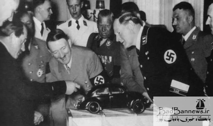 Ferdinand Porsche showing a model of the Volkswagen Beetle to Adolf Hitler, 1935